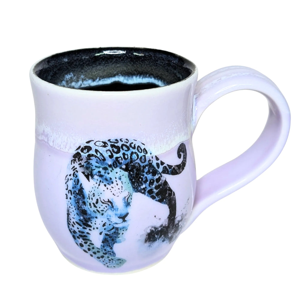 White mug with a leopard design on a white background