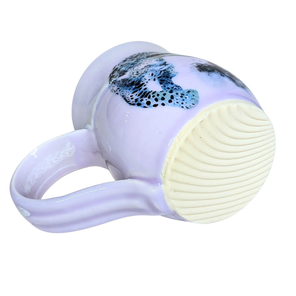 White facial cleansing brush with a silicone head on a white background