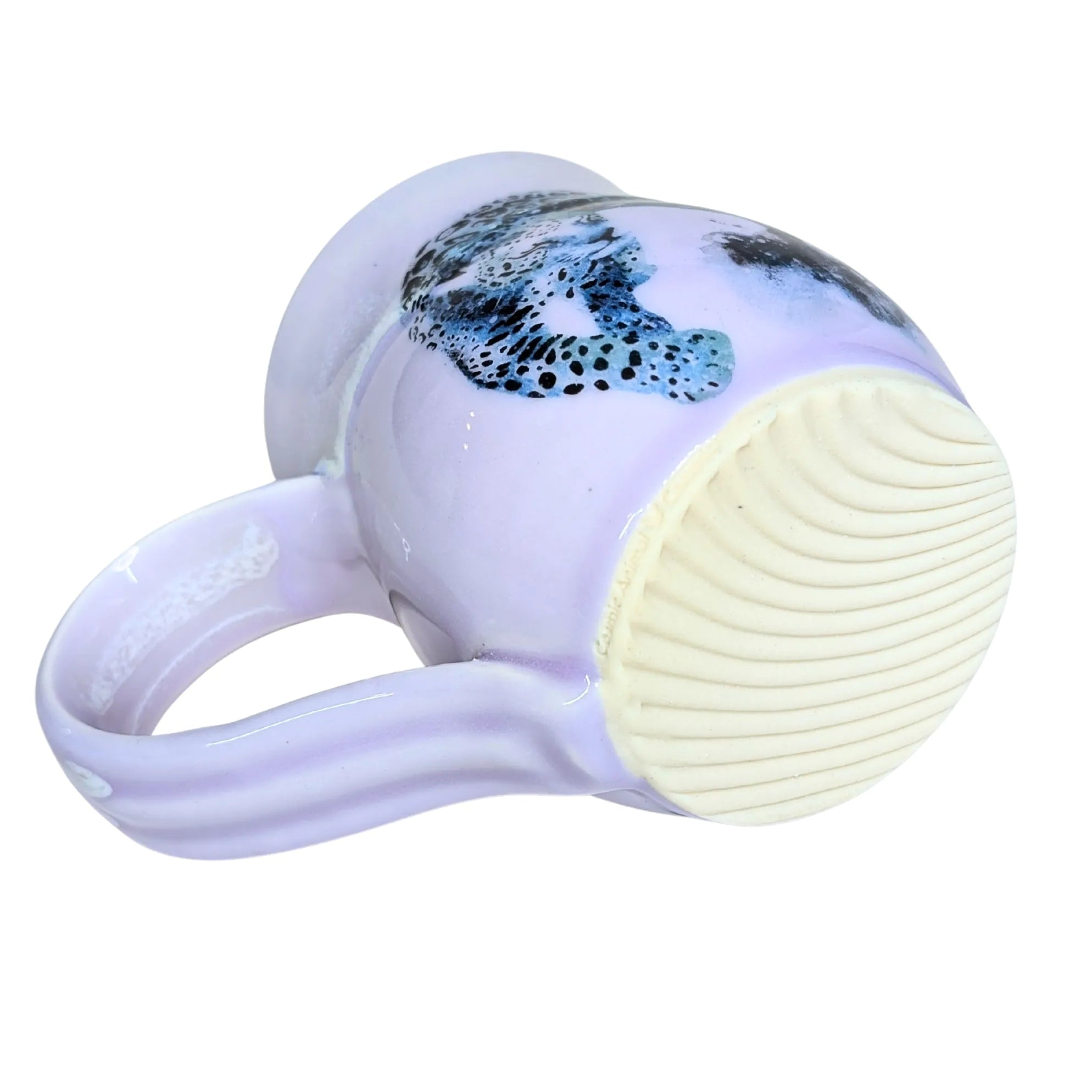 White facial cleansing brush with a silicone head on a white background