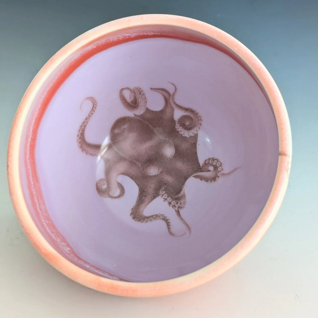 Ceramic bowl with an octopus design on a gradient background