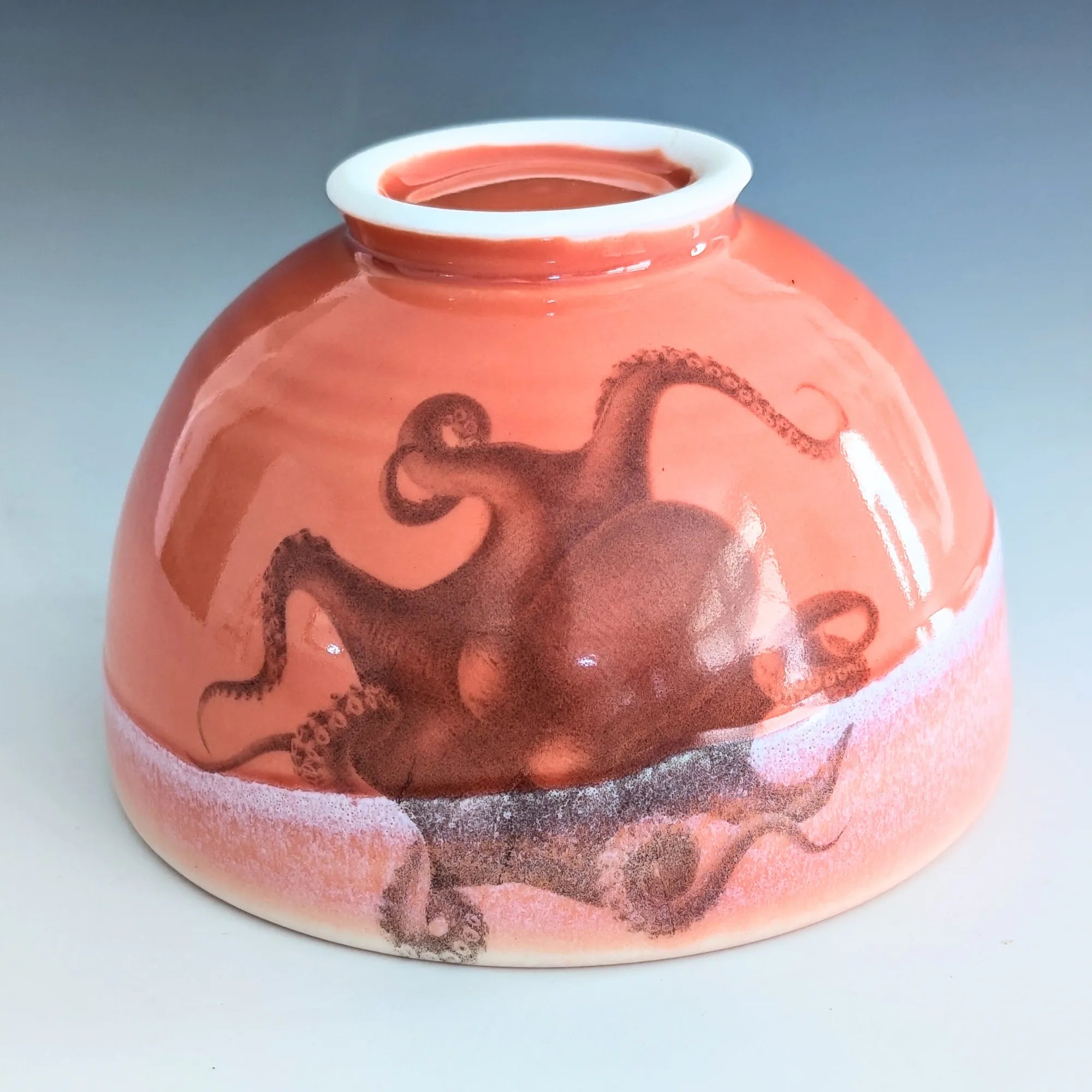 Ceramic bowl with octopus design on a gradient background