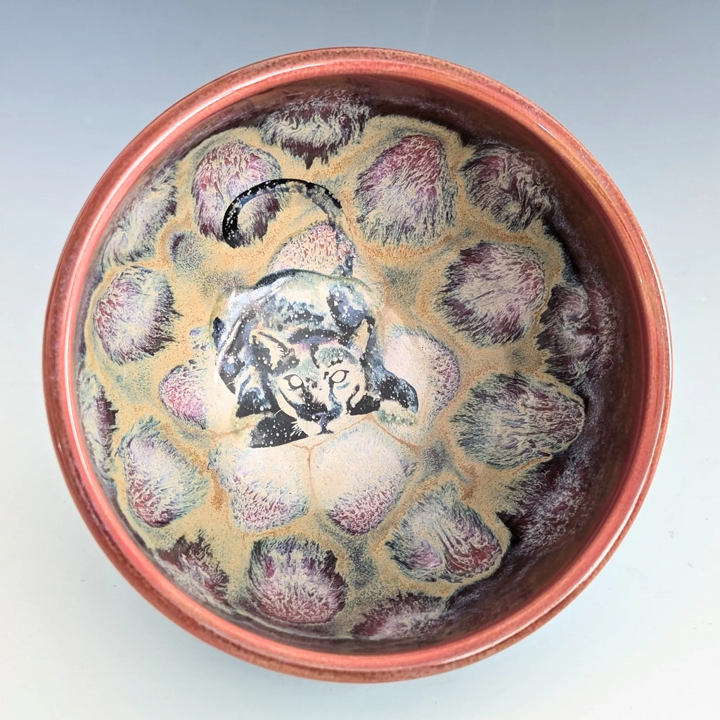 Ceramic bowl with decorative pattern on a light gray background