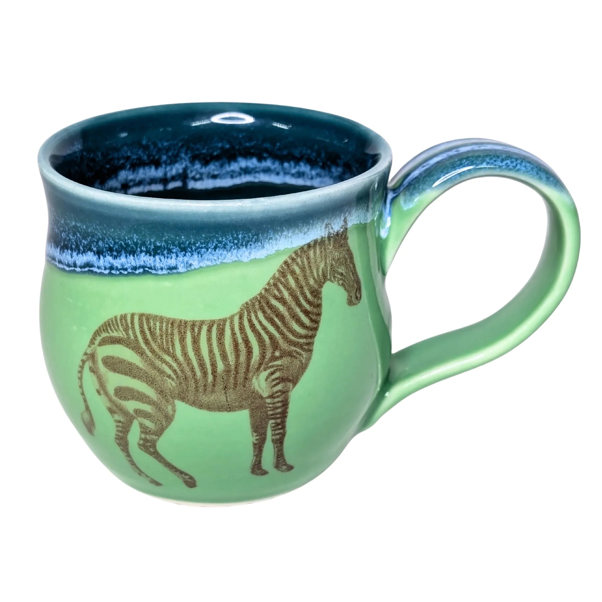 Green mug with zebra design and blue interior on a white background